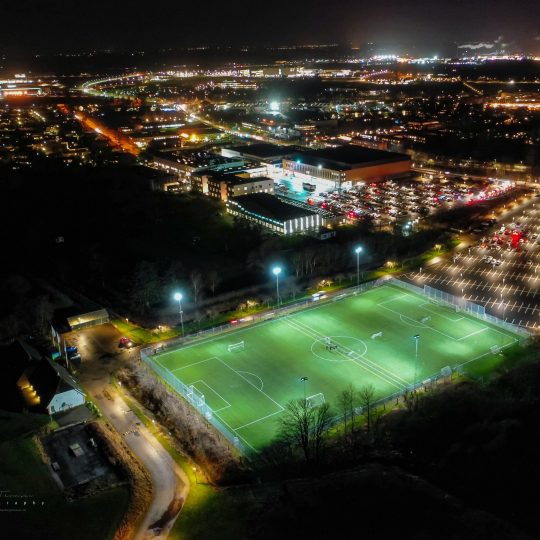 FIF football field with Frederiksborg Centret and Royal Stage in the background.